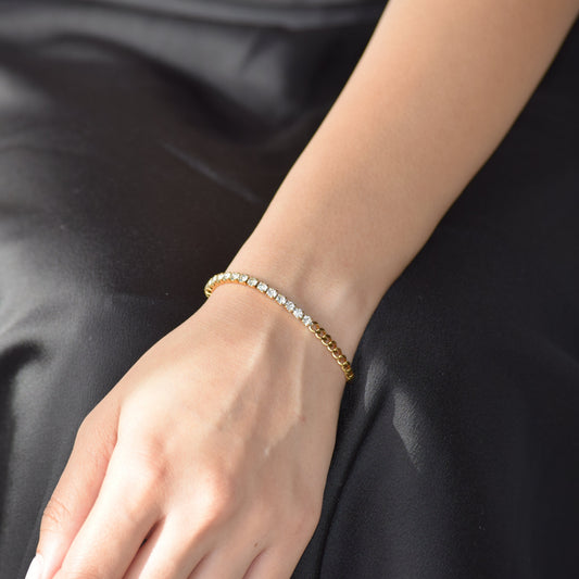 Gold Juxtapose Tennis Bracelet worn on wrist