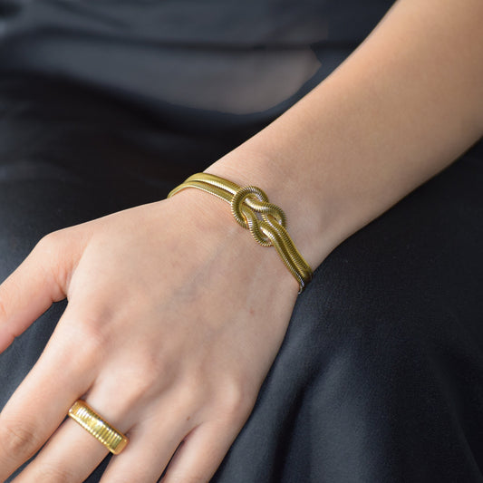 Gold Lovers Knot Bracelet styled with Rhythm Ring