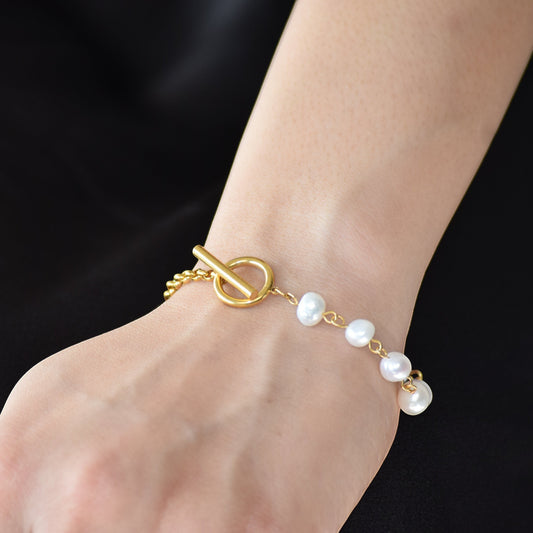 Gold Pearl Toggle Bracelet worn on wrist