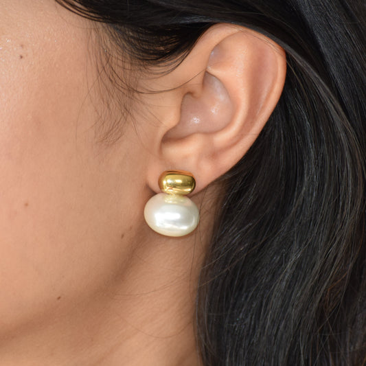 Gold Luminous Pearl Stud earring worn on ear