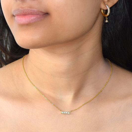 Gold Sparkle Bar Necklace worn on neckline