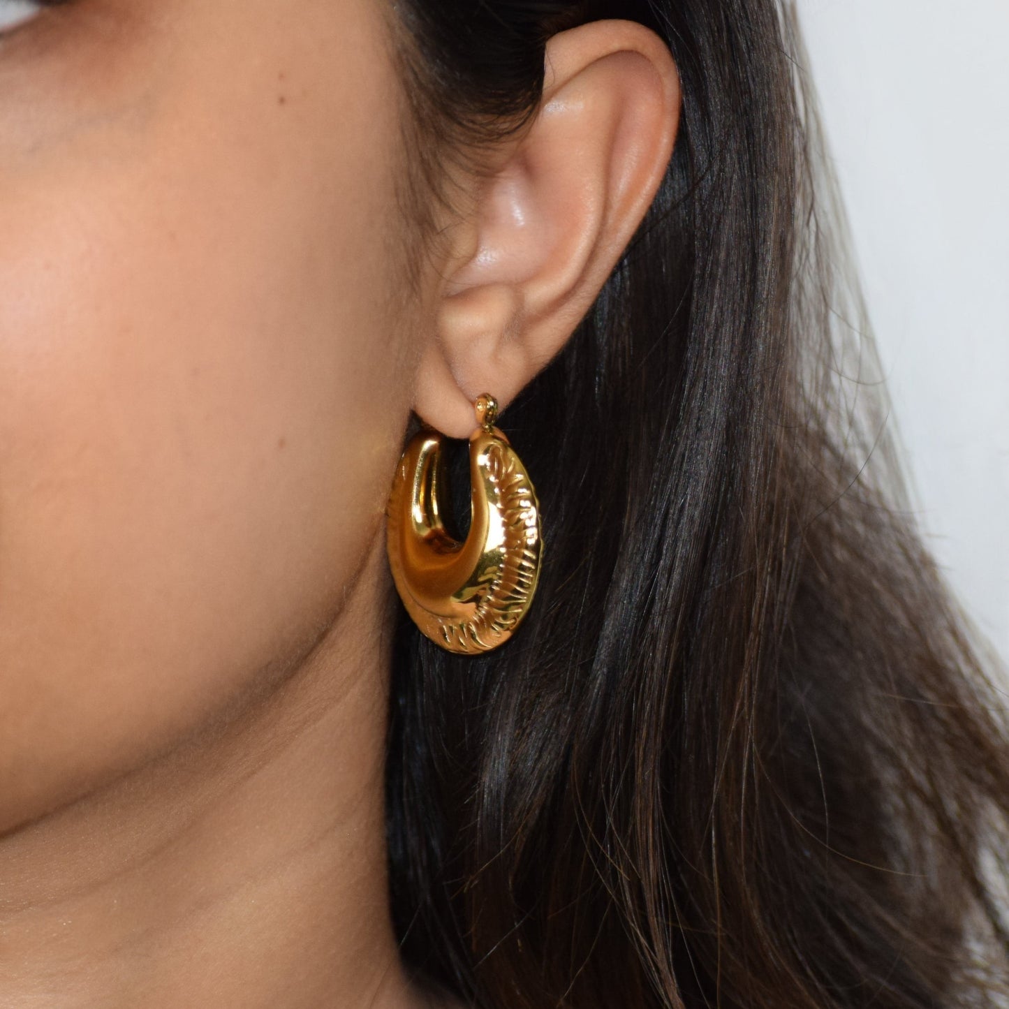 Armada Hoops worn on ear showing bold textured design