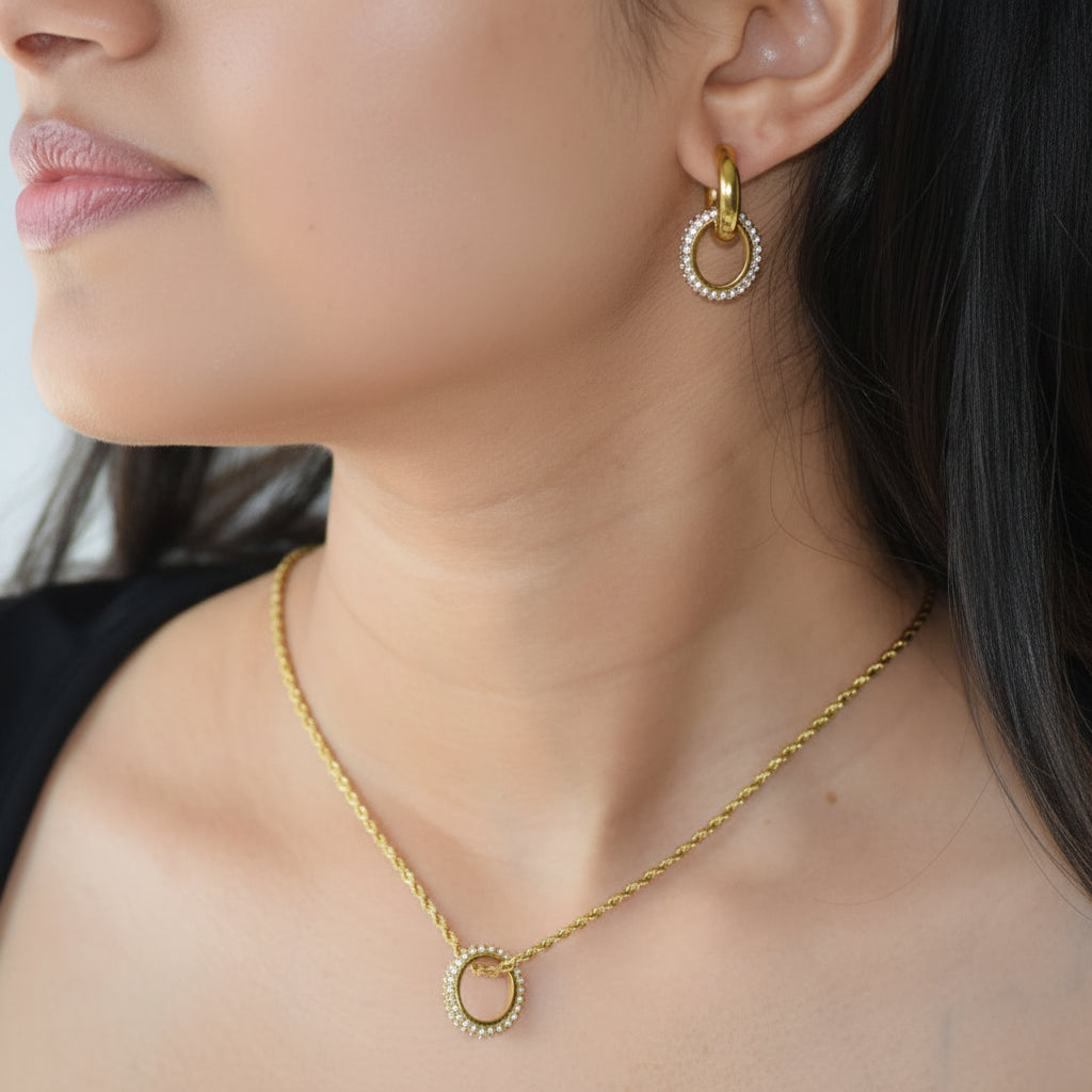 Glimmer Huggies styled with matching gold pendant necklace
