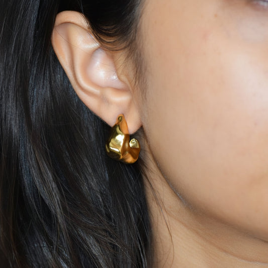 Gold Molten Half Hoops worn on ear with organic texture