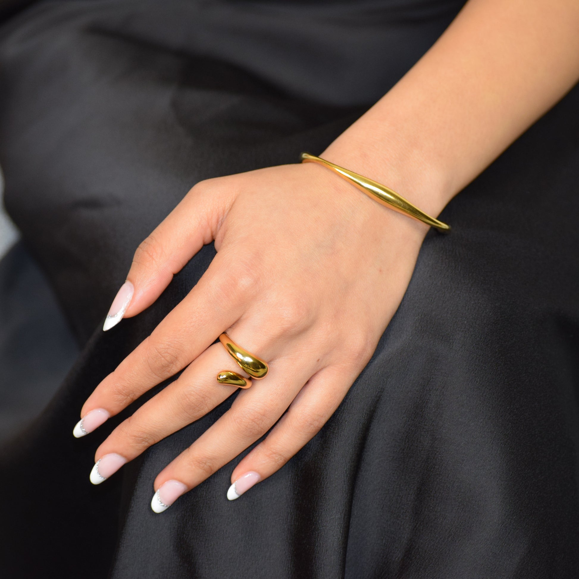 Gold Polished Arc Cuff styled with Flow Ring