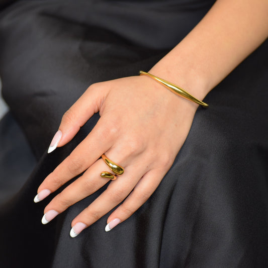 Gold Polished Arc Cuff styled with Flow Ring