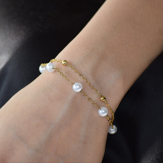 Gold Serene Pearl Bracelet worn on wrist
