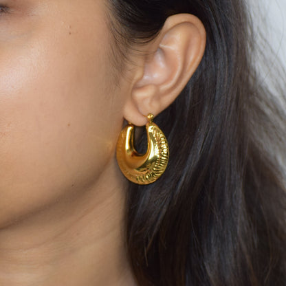 Gold Armada Hoops worn on model with woven textured finish