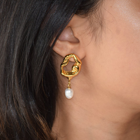Artisan Pearl Drop earring worn on ear with sculpted gold stud