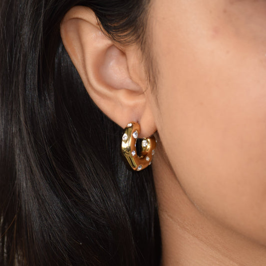 Gold Bubble Hoops worn on ear with rounded hoop design