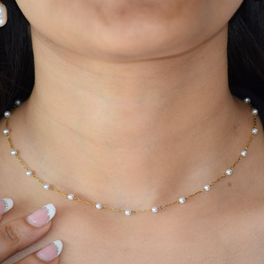 Gold Pearly Gates Necklace worn on neckline
