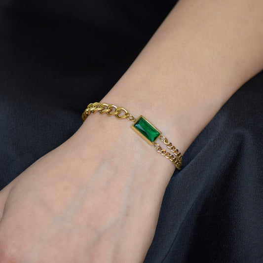 Gold Emerald Link Bracelet worn on wrist with green zircon accent