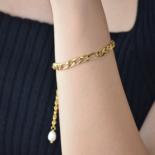 Gold Figaro Pearl Bracelet worn on wrist