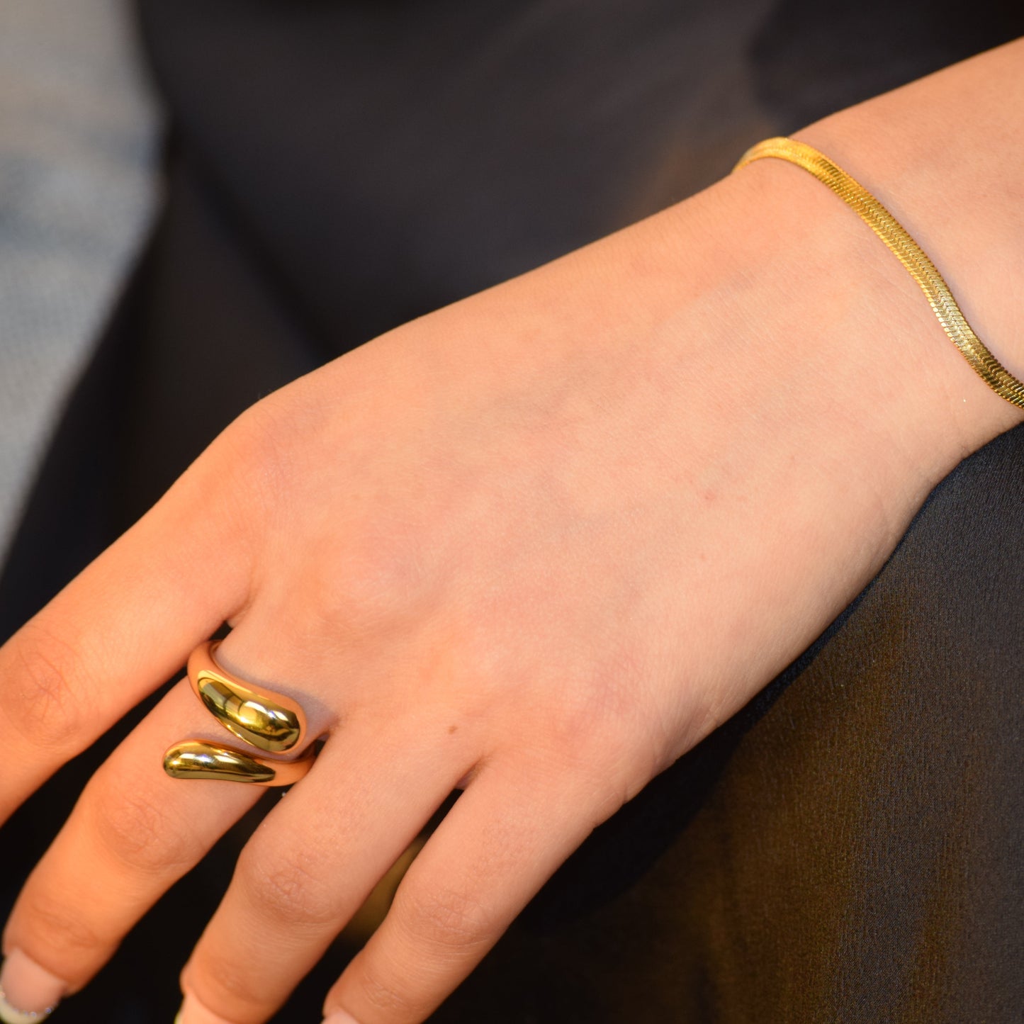 Gold Flow Ring worn on hand with sculptural open shape