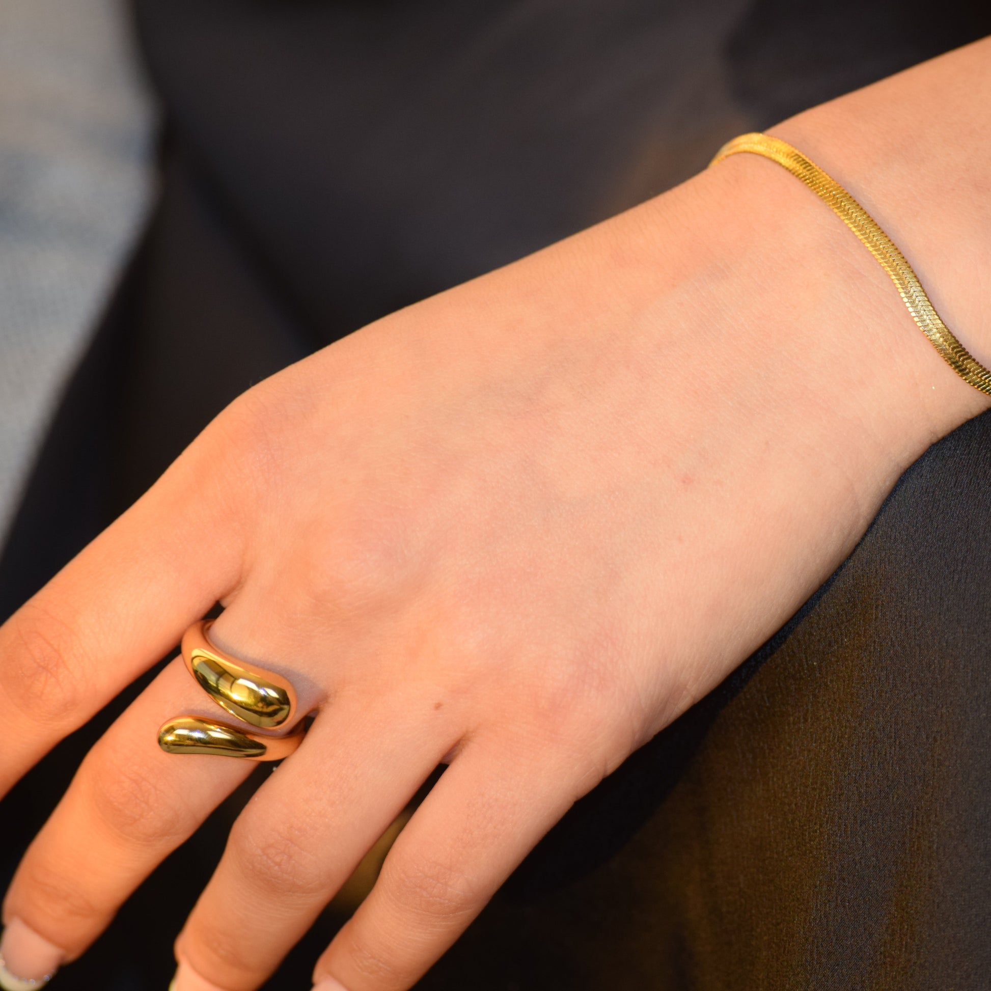 Gold Flow Ring worn on hand with sculptural open shape