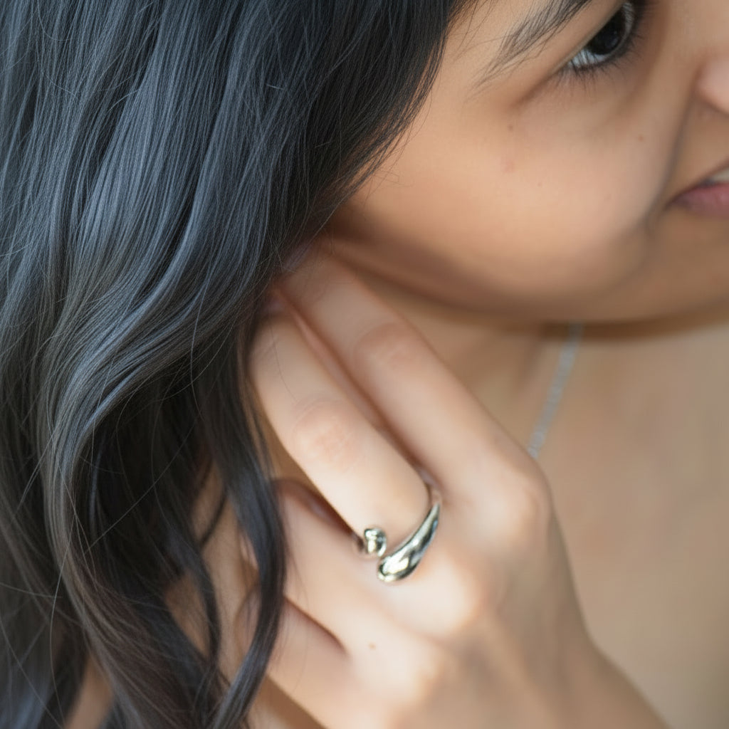 Silver Flow Ring worn on hand with sculptural open shape