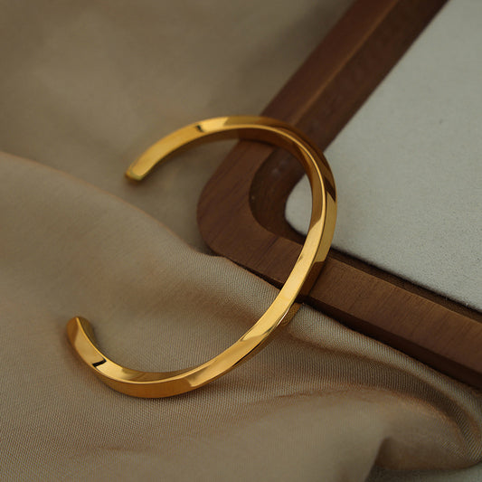 Gold Geometric Arc Cuff worn on wrist