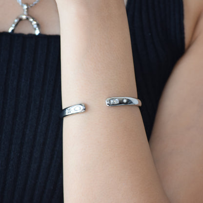 Silver Open Secret Cuff worn on wrist