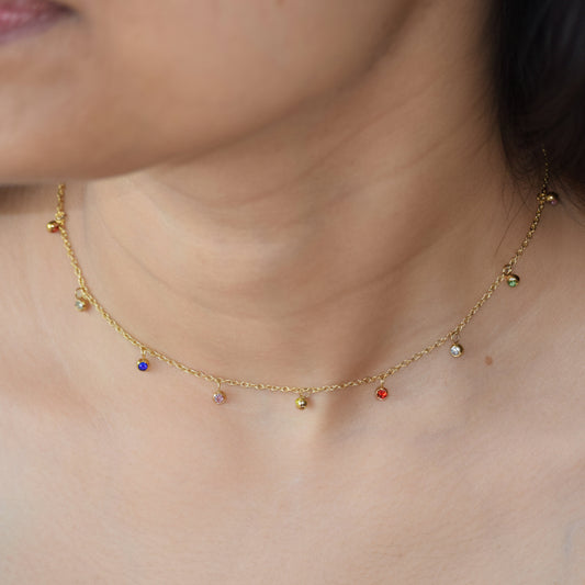 Gold Rainbow Dew Drops Necklace worn on neckline