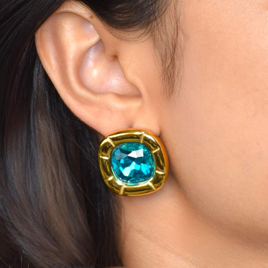 Aqua blue zircon statement stud earring worn on ear