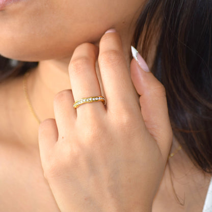 RINARA Cobblestone Pave Ring in 18K gold plated stainless steel with sparkling zircon stones worn on a finger