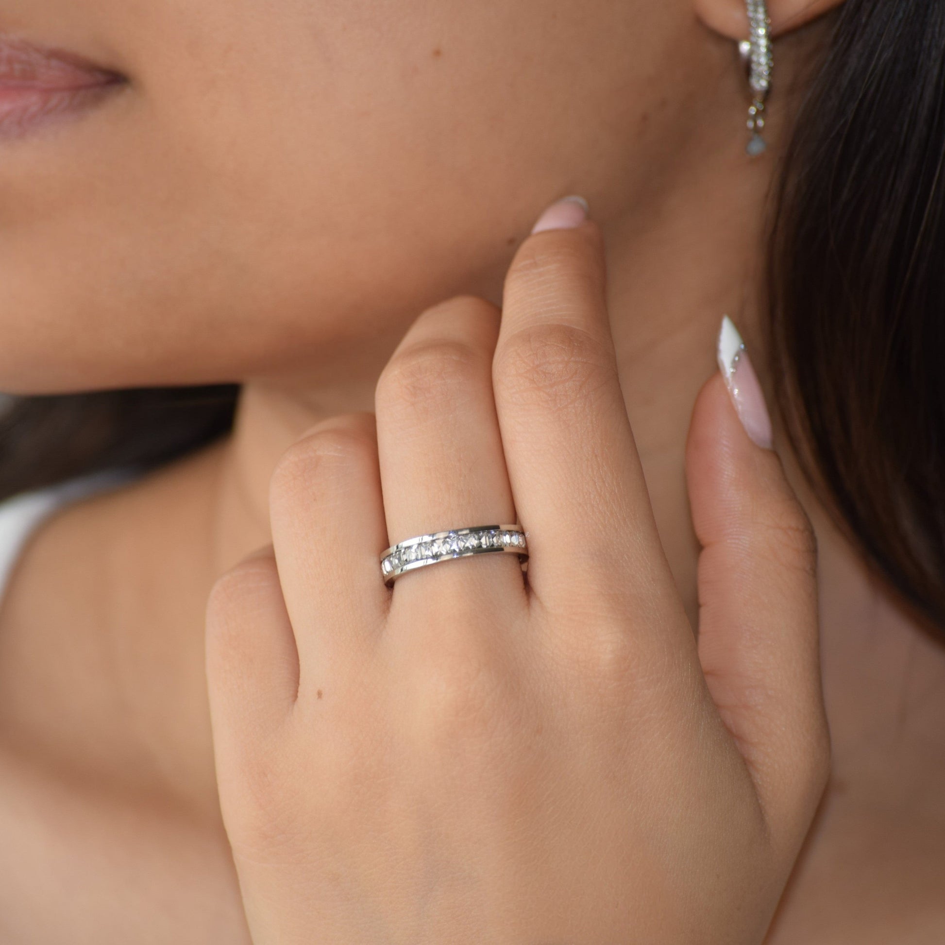 Silver Eternity Ring worn on finger with sparkling zircon stones