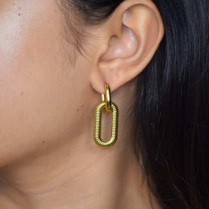 Gold Woven Link earring worn on ear with textured links