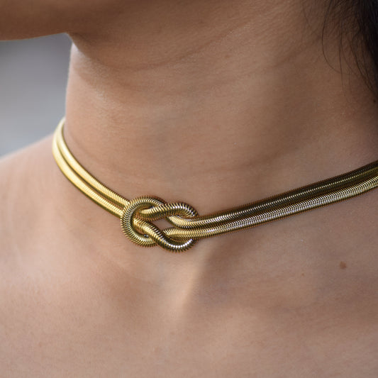 Gold Lovers Knot Necklace worn as choker