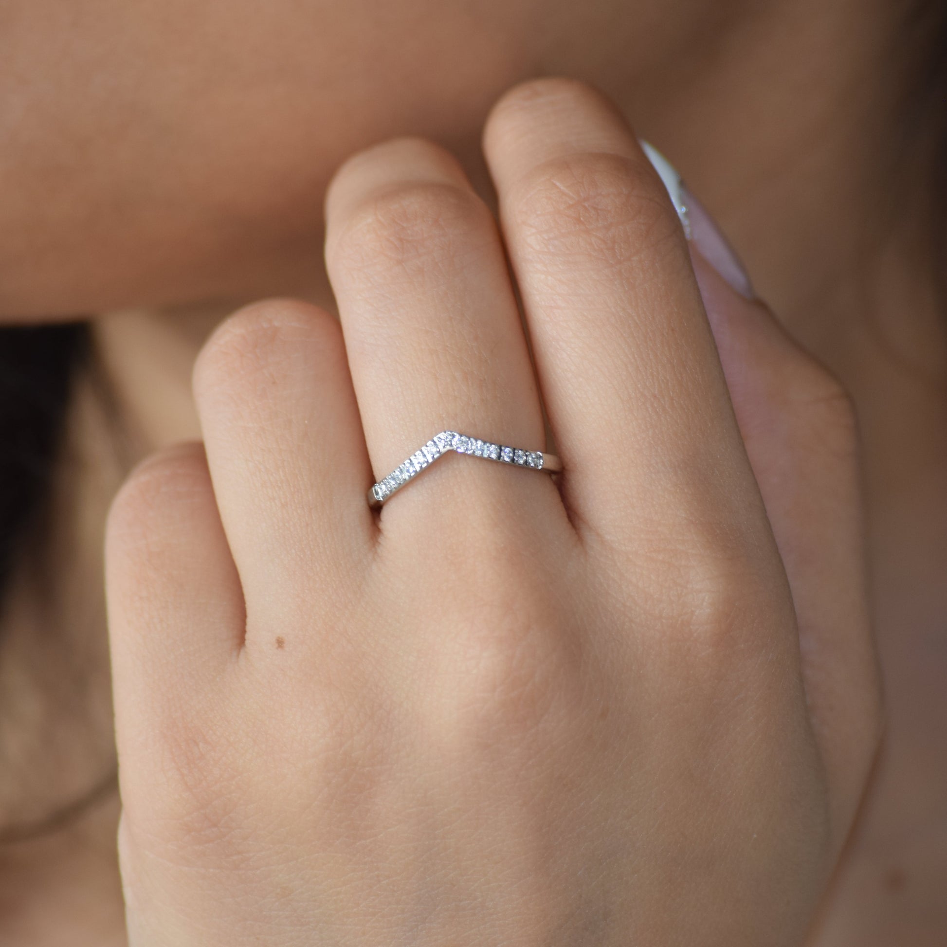 Silver Tiara zircon ring worn on hand